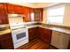 Modern kitchen with granite countertops and wood cabinets at 6632 Meritmoor, Orlando, FL 32818