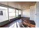 Bright sunroom with wood-look tile floor and backyard access at 6632 Meritmoor, Orlando, FL 32818