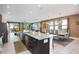 Open concept kitchen with large granite island at 7736 Graben St, Kissimmee, FL 34747