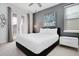 Bedroom with king-size bed, gray accent wall, and private access to patio at 7736 Graben St, Kissimmee, FL 34747