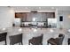Modern kitchen with granite countertops, stainless steel appliances, and breakfast bar at 7736 Graben St, Kissimmee, FL 34747