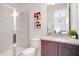 Bathroom with single vanity and walk-in shower at 7736 Graben St, Kissimmee, FL 34747
