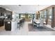Open concept kitchen and dining area with large table and modern lighting at 7736 Graben St, Kissimmee, FL 34747