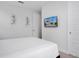 Bedroom with mounted TV and modern decor at 7736 Graben St, Kissimmee, FL 34747