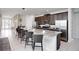 Modern kitchen with granite countertops, stainless steel appliances, and breakfast bar at 7736 Graben St, Kissimmee, FL 34747