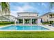 Stunning two-story home with a large, inviting pool and spacious patio at 7736 Graben St, Kissimmee, FL 34747