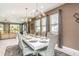 Modern dining room with large table and statement lighting at 7736 Graben St, Kissimmee, FL 34747