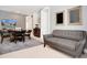 Finished basement with game table, sofa, and bar area at 7736 Graben St, Kissimmee, FL 34747