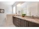Elegant bathroom with double vanity and granite countertops at 7736 Graben St, Kissimmee, FL 34747