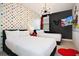 Mickey Mouse themed bedroom with two twin beds and colorful decor at 7736 Graben St, Kissimmee, FL 34747