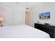 Spacious bedroom with a comfortable bed and a large closet at 7736 Graben St, Kissimmee, FL 34747