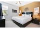 Bright bedroom with king-size bed and modern decor at 7736 Graben St, Kissimmee, FL 34747