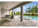 Covered patio with dining area overlooking the pool at 7736 Graben St, Kissimmee, FL 34747
