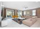 Open living area with sectional sofa and access to backyard at 7736 Graben St, Kissimmee, FL 34747