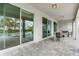 Covered patio with seating area and pool view at 7736 Graben St, Kissimmee, FL 34747