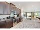 Kitchen features granite countertops and stainless steel appliances at 7736 Graben St, Kissimmee, FL 34747