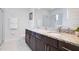 Bathroom with double vanity and granite countertop at 7736 Graben St, Kissimmee, FL 34747