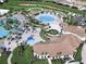 Aerial view of community with pools and clubhouse at 9030 Shadow Mountain St, Davenport, FL 33896
