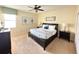 Bright bedroom featuring a king-size bed, and ceiling fan at 9030 Shadow Mountain St, Davenport, FL 33896