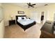 Comfortable bedroom with a king-size bed and ample closet space at 9030 Shadow Mountain St, Davenport, FL 33896