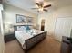 Spacious bedroom with king-size bed, nightstands, and closet at 9030 Shadow Mountain St, Davenport, FL 33896