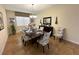 Bright dining room, featuring a large table and six chairs at 9030 Shadow Mountain St, Davenport, FL 33896
