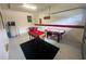 Game room with foosball, pool, and air hockey tables at 9030 Shadow Mountain St, Davenport, FL 33896