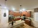 Well-lit kitchen with granite countertops and an island at 9030 Shadow Mountain St, Davenport, FL 33896