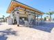 Relaxing pool bar with tables and chairs at 9030 Shadow Mountain St, Davenport, FL 33896