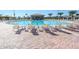 Large resort-style pool with lounge chairs and a pool bar at 9030 Shadow Mountain St, Davenport, FL 33896