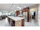 Modern kitchen with island, stainless steel appliances and breakfast bar at 9195 Chandler Dr, Groveland, FL 34736