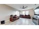 Gathering room with leather recliners, fireplace, and large TV at 9195 Chandler Dr, Groveland, FL 34736
