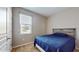 Bright bedroom with a double bed and window blinds at 9195 Chandler Dr, Groveland, FL 34736