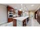 Spacious kitchen with island, stainless steel appliances, and hardwood floors at 9195 Chandler Dr, Groveland, FL 34736