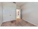 Small bedroom with double doors leading to closet at 9195 Chandler Dr, Groveland, FL 34736