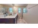 Bathroom boasts double vanity and a large walk-in shower at 9195 Chandler Dr, Groveland, FL 34736