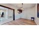 Dining room with wood-look floors and a rustic chandelier at 9195 Chandler Dr, Groveland, FL 34736