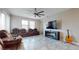 Spacious living room with a fireplace and reclining seating at 9195 Chandler Dr, Groveland, FL 34736