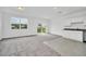 Spacious Gathering room with carpet and sliding glass doors to backyard at 246 Mandovi St, Davenport, FL 33837