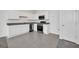 Modern kitchen with white cabinets and stainless steel appliances at 246 Mandovi St, Davenport, FL 33837