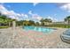 Community pool with lounge chairs and surrounding landscaping at 246 Mandovi St, Davenport, FL 33837