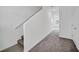 Bright entry hall with staircase and neutral carpeting at 246 Mandovi St, Davenport, FL 33837