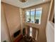 High-ceiling living room with large windows and balcony view at 3131 Brasilia Ave, Kissimmee, FL 34747