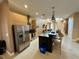 Modern kitchen with stainless steel appliances and island with seating at 3131 Brasilia Ave, Kissimmee, FL 34747
