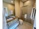 Bathroom with granite countertop, large shower, and toilet at 3131 Brasilia Ave, Kissimmee, FL 34747