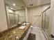 Elegant bathroom with a granite double vanity and shower at 3131 Brasilia Ave, Kissimmee, FL 34747