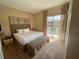 King-size bed in a bedroom with access to balcony at 3131 Brasilia Ave, Kissimmee, FL 34747
