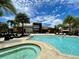 Resort-style pool and spa with lounge chairs at 3131 Brasilia Ave, Kissimmee, FL 34747