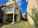 Backyard patio with grill and seating area next to a modern home at 3131 Brasilia Ave, Kissimmee, FL 34747