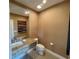 Modern bathroom with granite countertop and a toilet at 3131 Brasilia Ave, Kissimmee, FL 34747